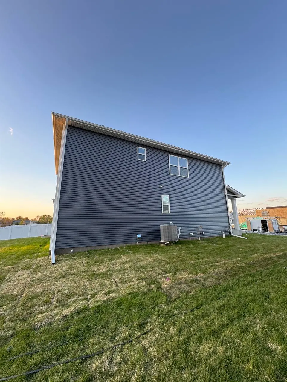 Seamless gutter installation on a two-story home in Howard Lake MN