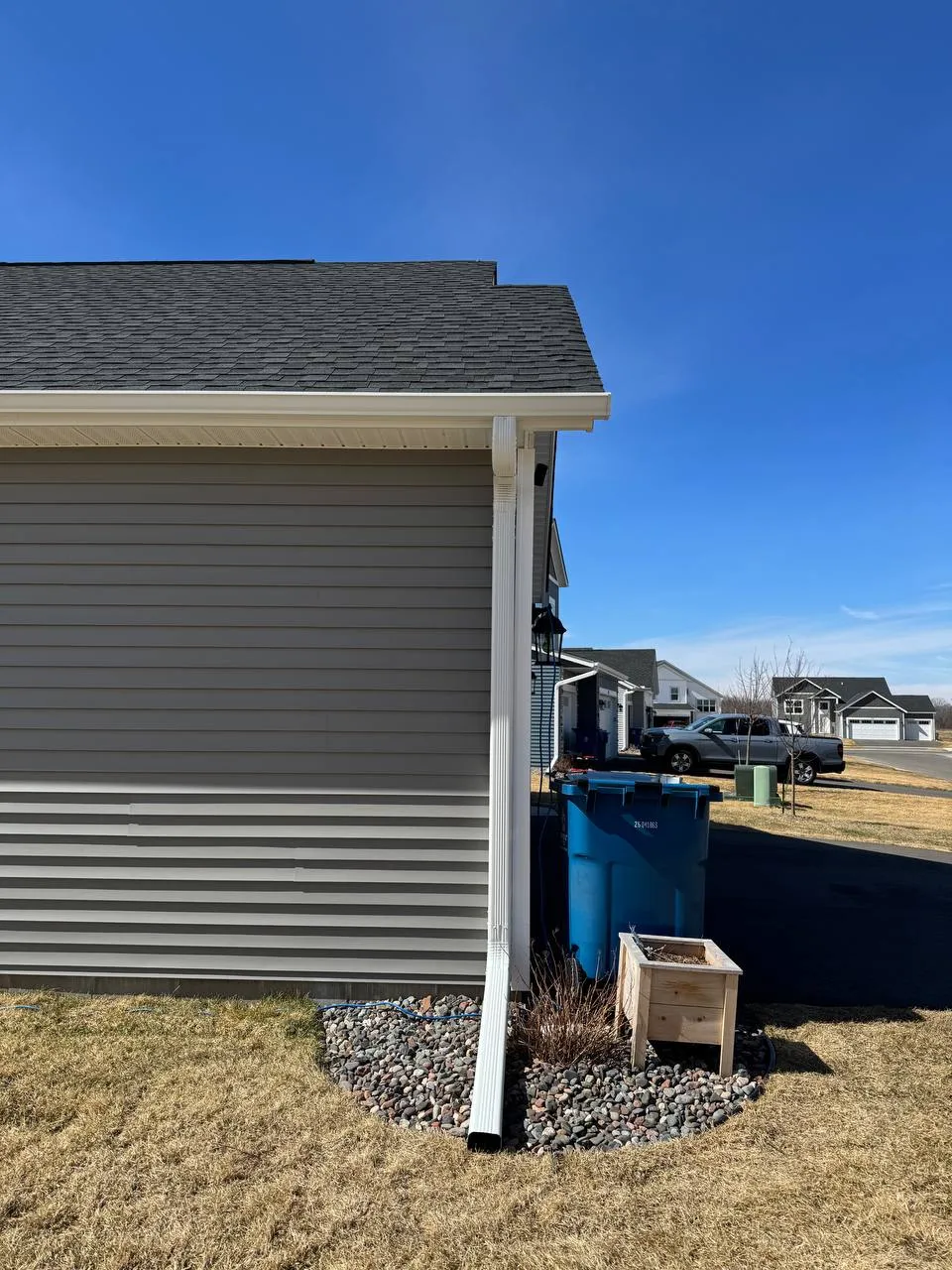 Rear yard gutter and downspout drainage on a Woodbury MN home