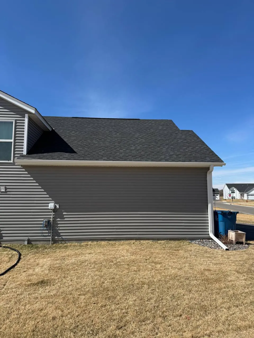 Downspout and gutter system installed on the rear of a home in Woodbury MN