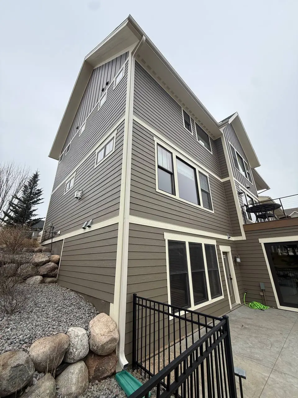 Custom seamless gutter installation on a large home in Woodbury MN