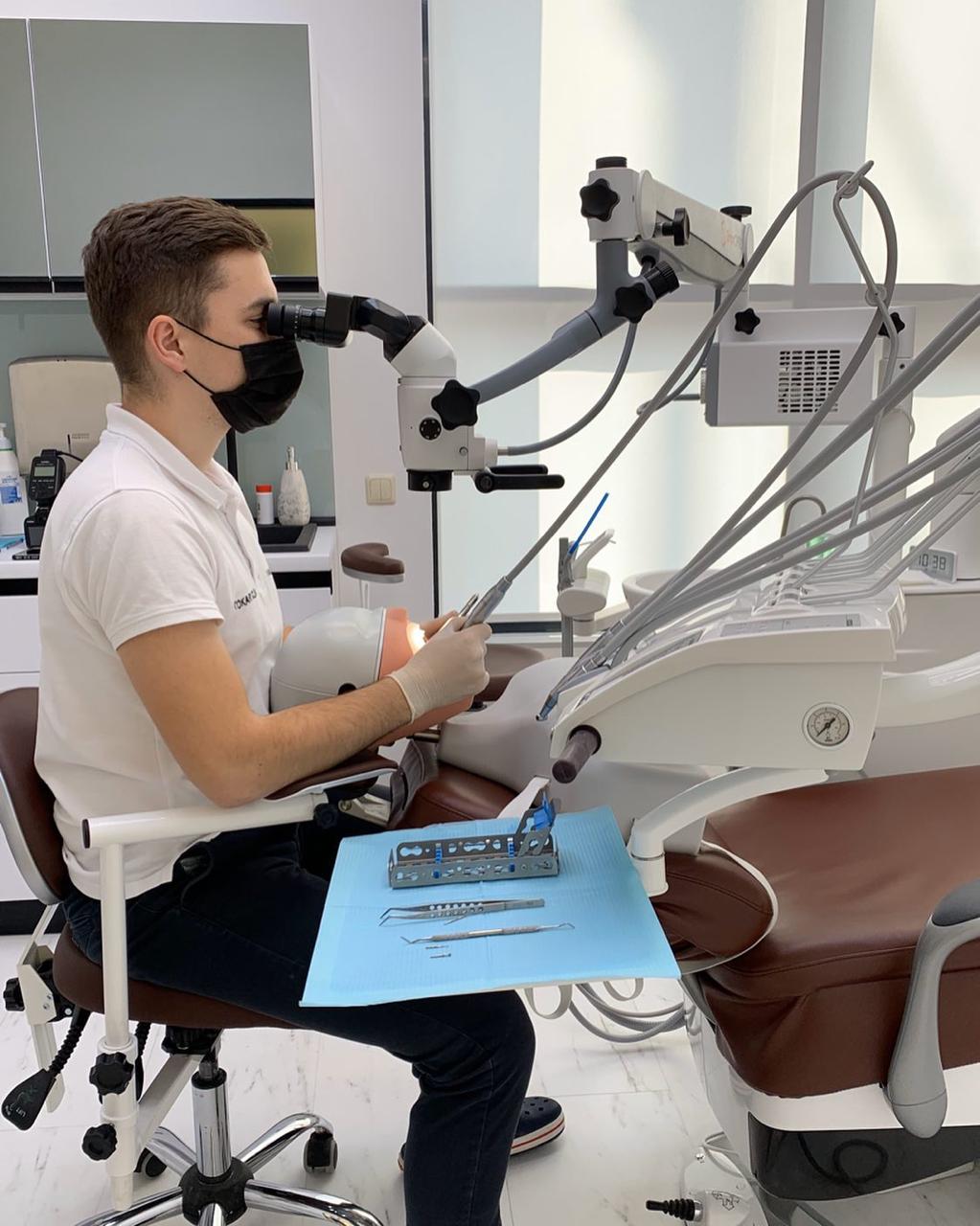 Vitalii, founder of Panda Gutters, working as a dentist in Ukraine