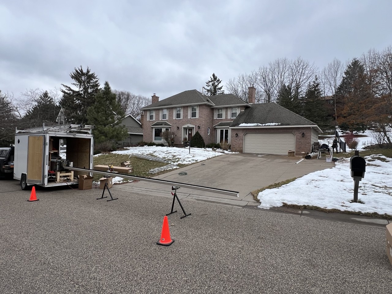 Panda Gutters truck and seamless gutter machine at a job site