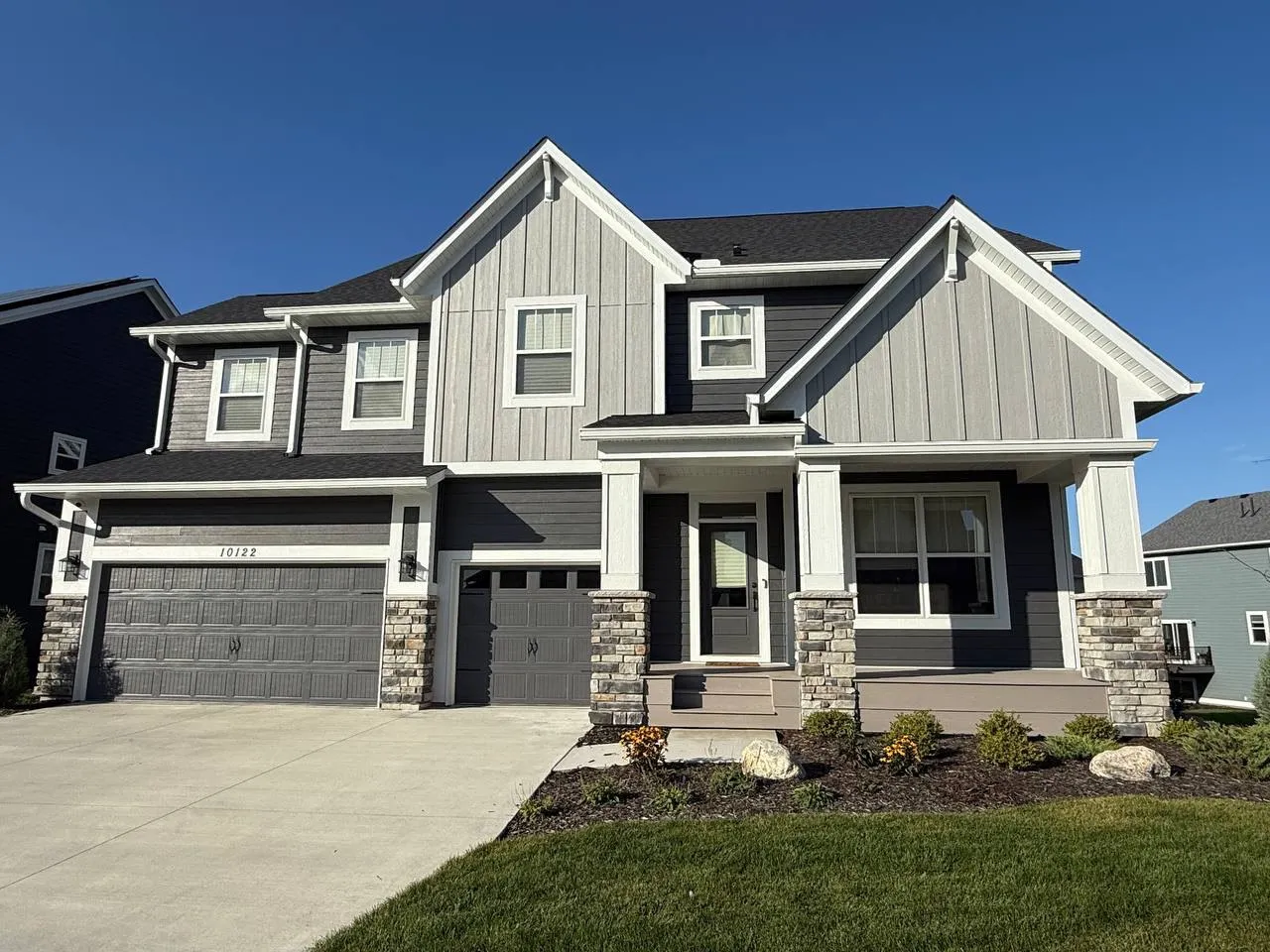 Complete seamless gutter system on a modern craftsman home in Minnetonka, MN
